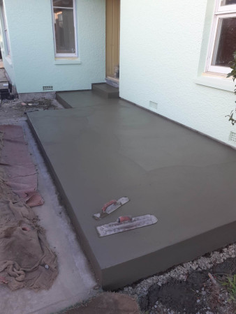 concrete patio with troweled rises and steps