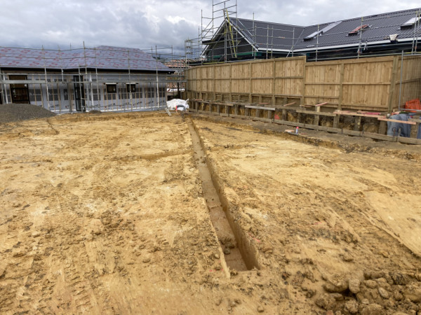 Slab prep, site cut, trenching, retaining wall