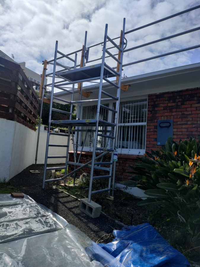 Use portable scaffold to get to roof.