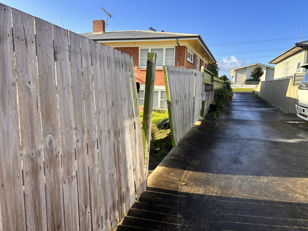 Whoever built this fence forgot to put the post in the concrete