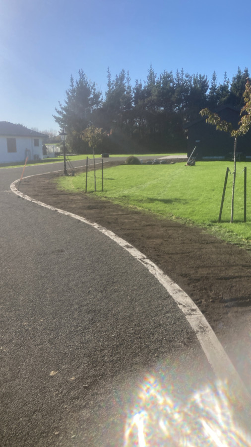 Building up sunken lawn edge with sourced top soil
