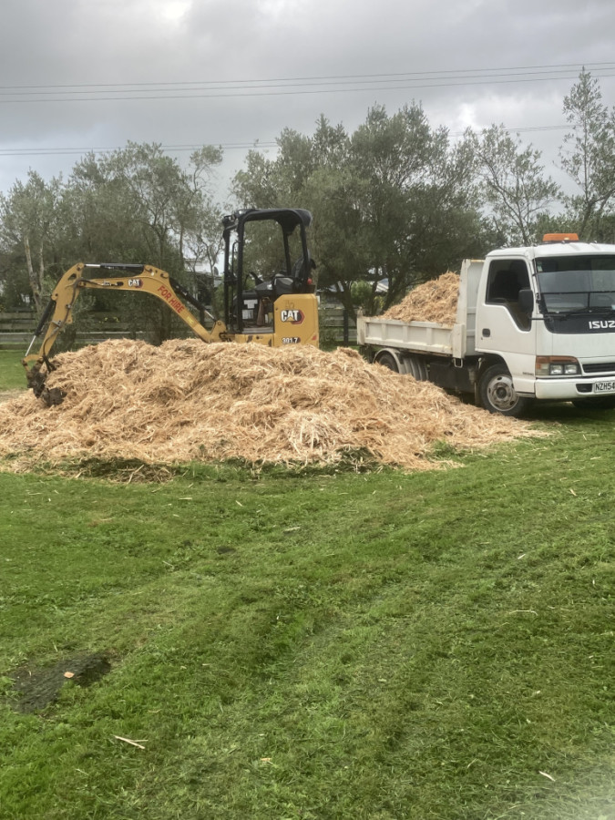 Pile of post shavings supplied and ready to be spread around a large section