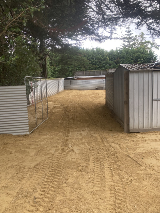 Spreading supplied lime in a dog run area