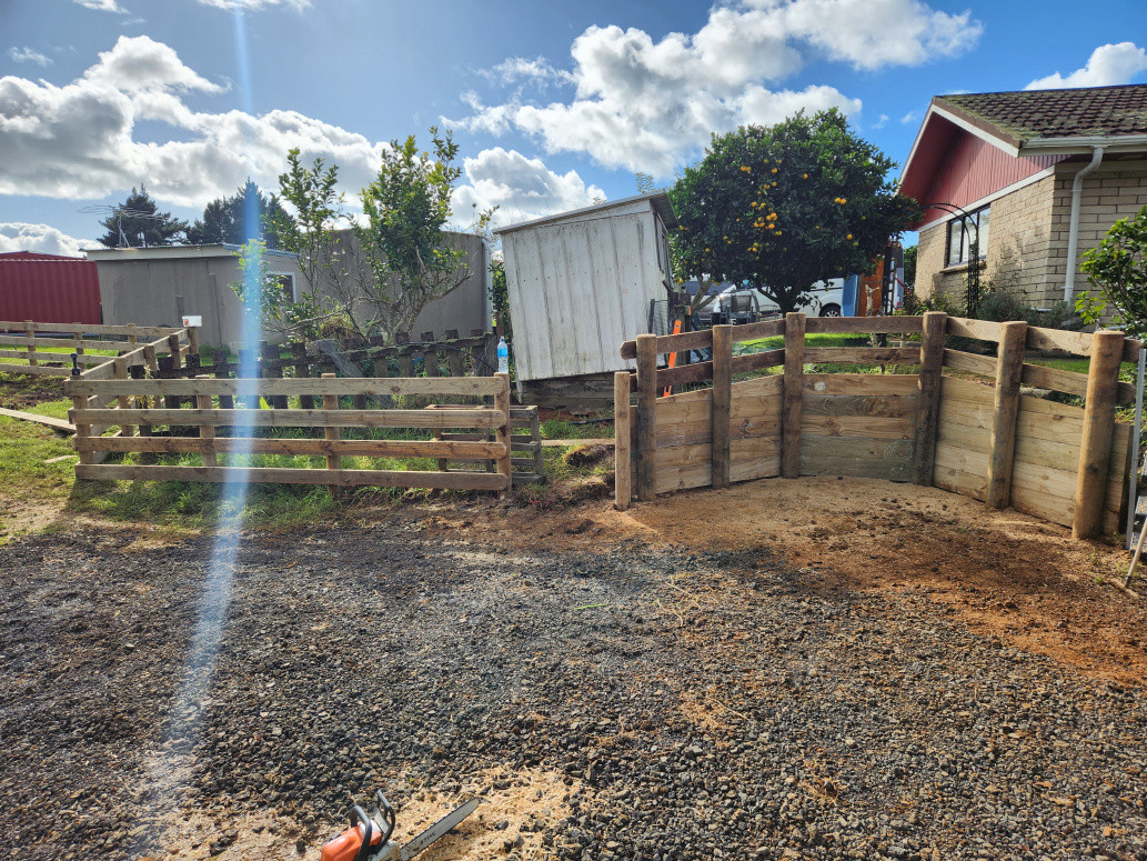 Retaining wall for water tank and post and rail