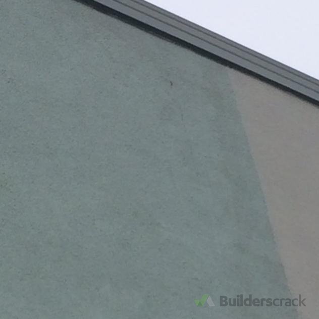 Paint a hairline crack on plaster wall up high, 2 level house