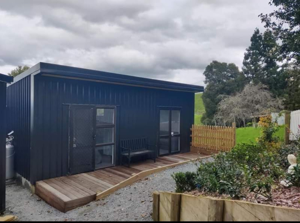 Tiny home, 30m² self contained unit construction. Deck and fencing.