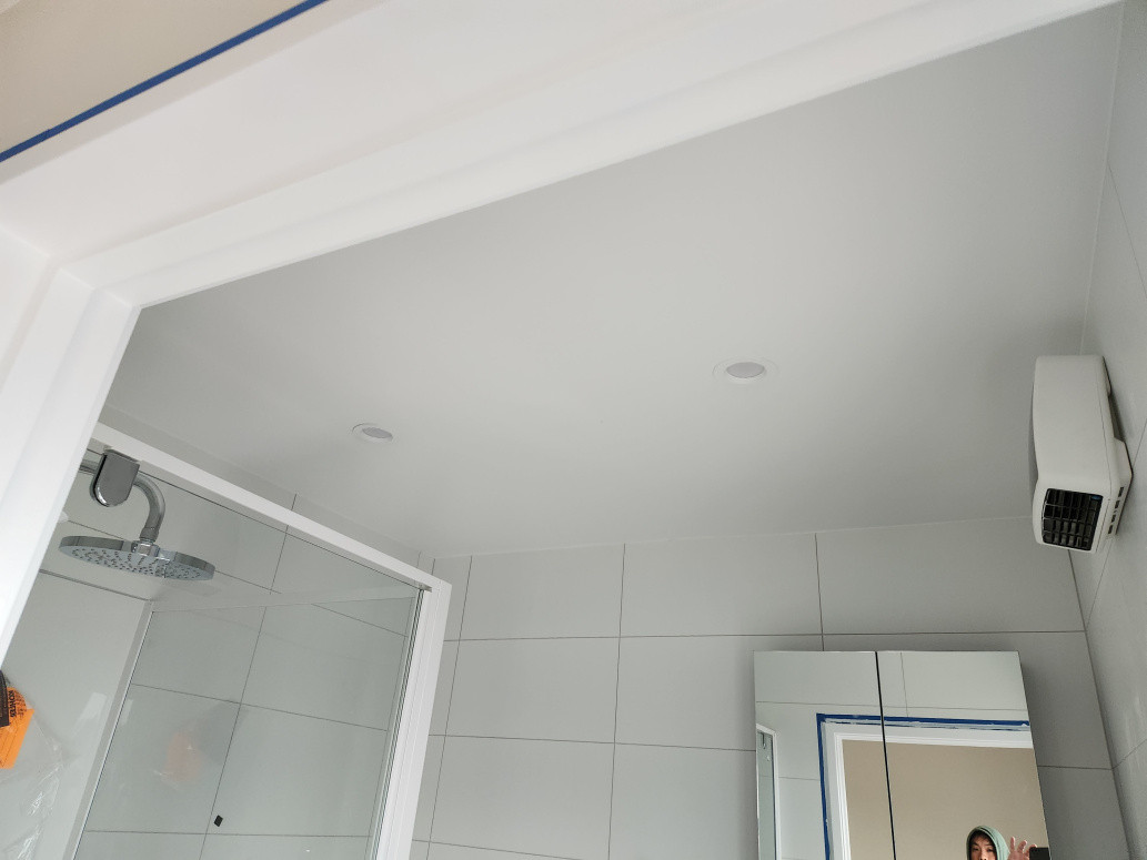 Installed recessed downlights in a new bathroom