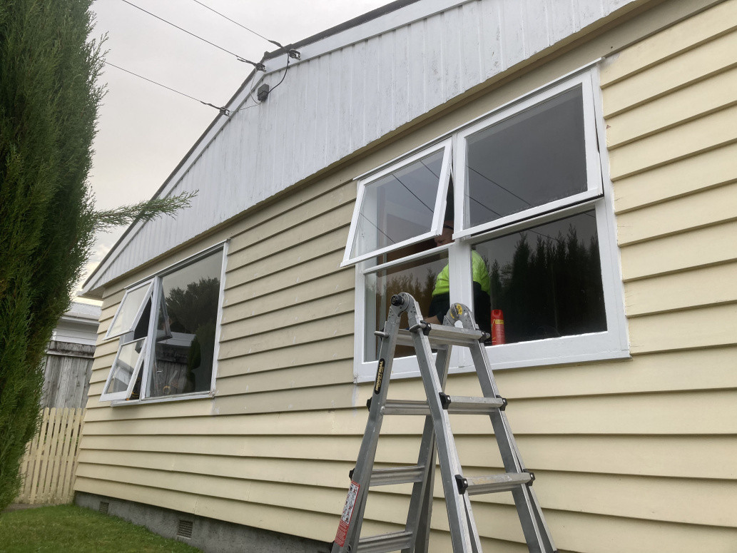 Old timber framed single glazed joinery removed