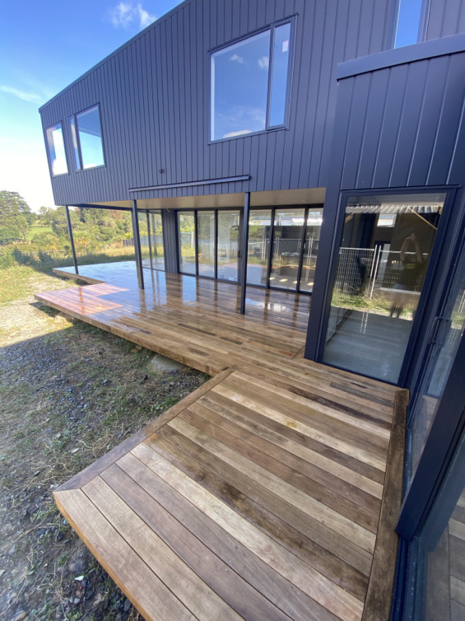 Vitex deck wrapped up for a local home building company — this one finished in Vitex hardwood for a clean, natural look with great durability.