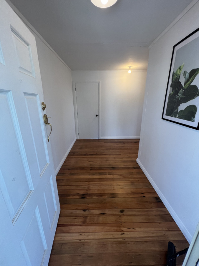 Updated entry way. relocated entry door, Installed timber floors, built and insulated walls. Fitted door and trims.