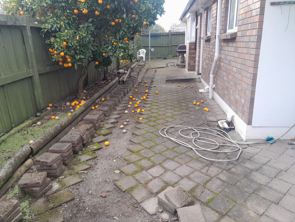 Re laying pavers and retaining wall before