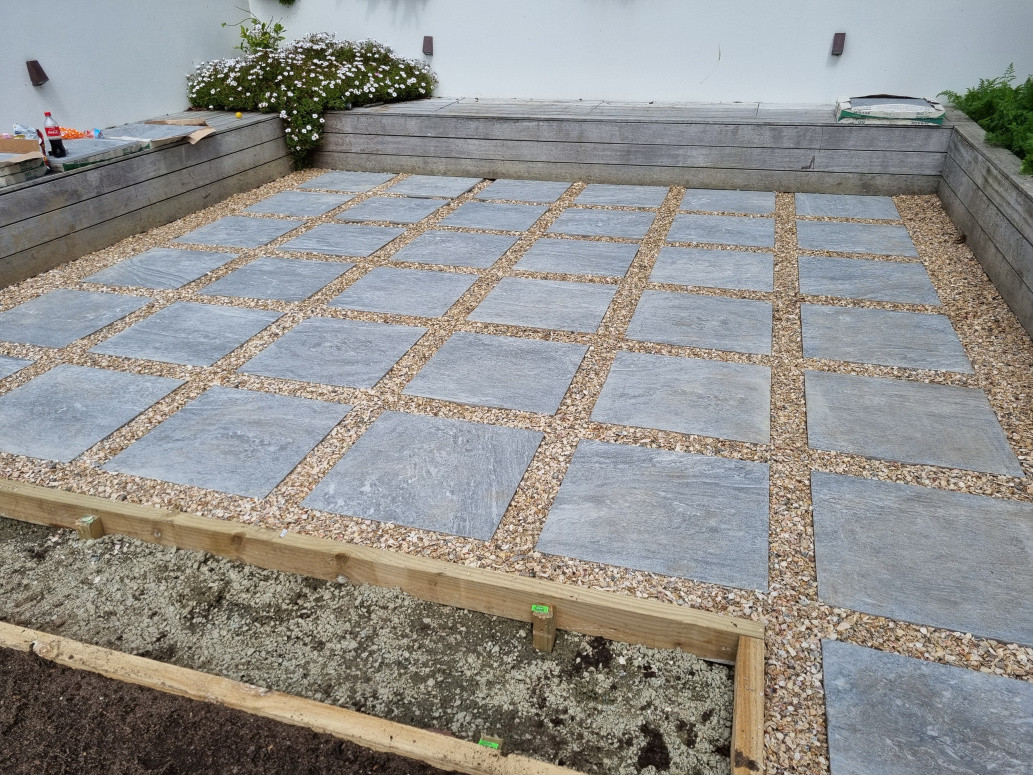 grid paving with timber edges finished with Waikato flek pebble