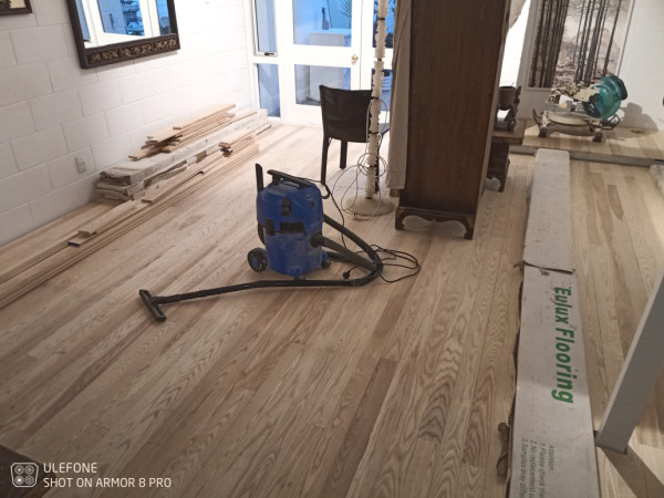 Maple solid timber flooring laid over concrete.