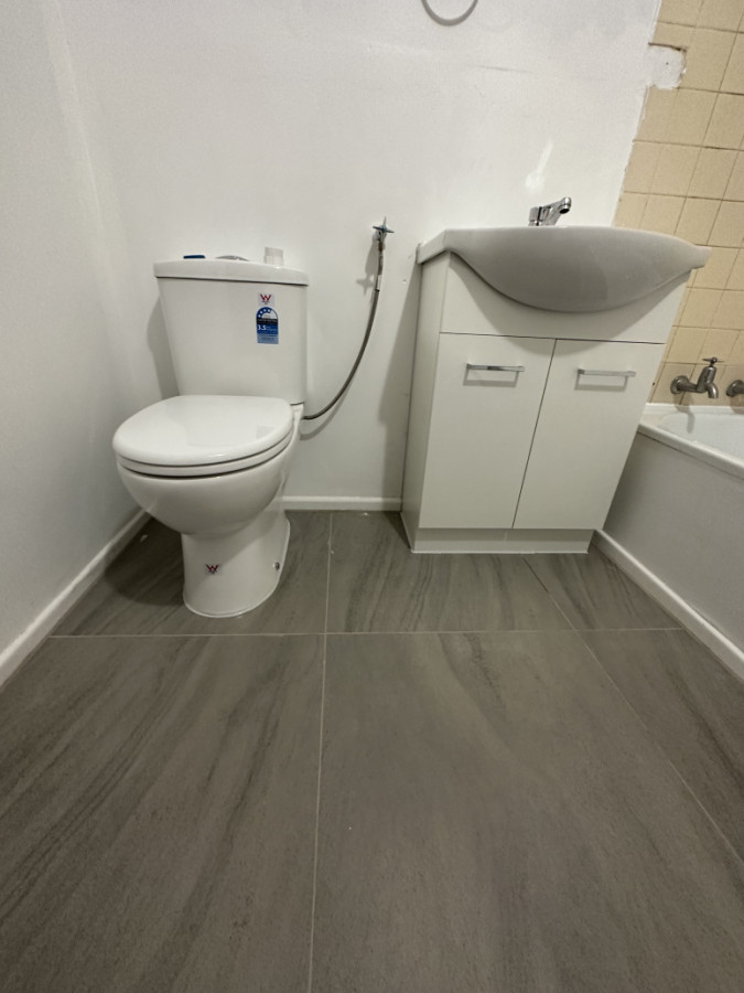 Flooring, vanity and toilet install