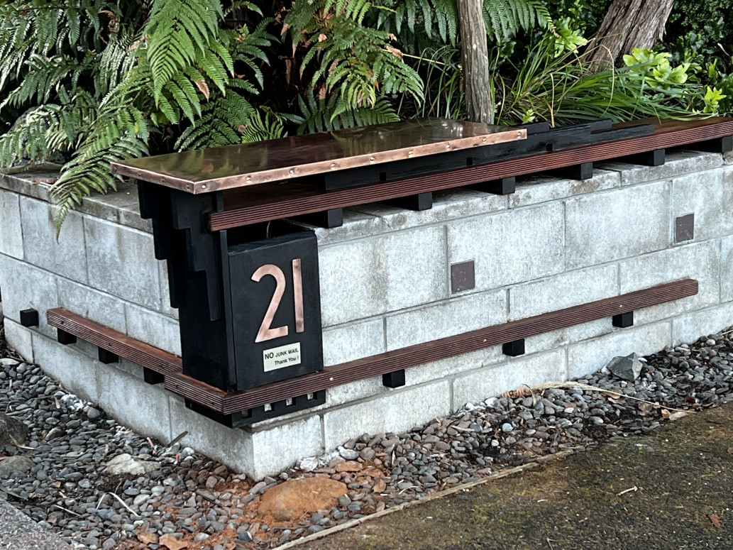 Refurbished architectural letter box built from copper and kwila