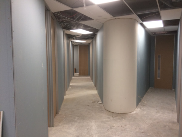 Tight radius curved wall interescting two corridors