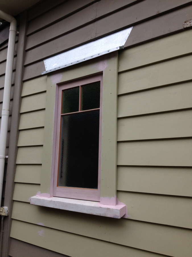 Replacement window with  head flashing