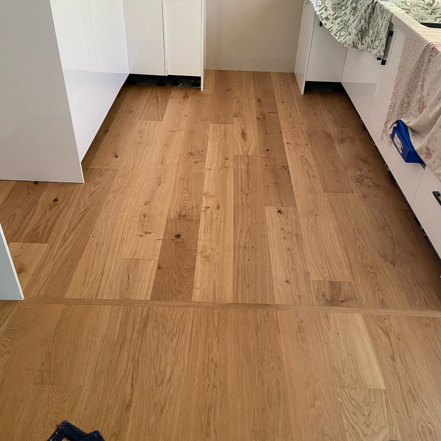 Replaced ceramic tiles in kitchen with engineered timber
