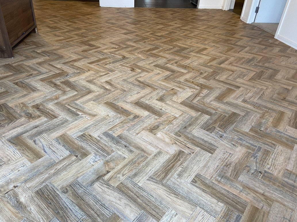 Herringbone pattern vinyl plank