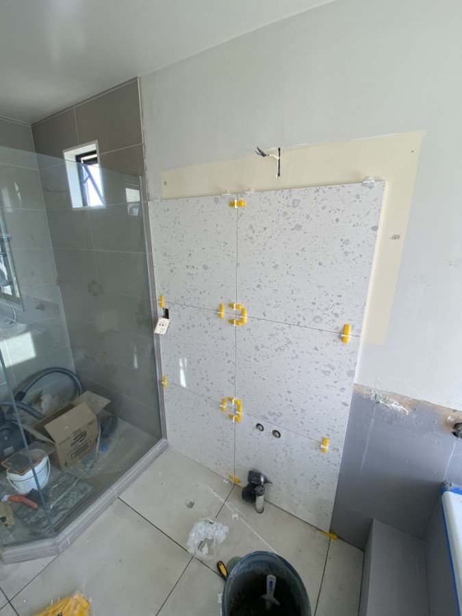 Feature wall tiling in progress