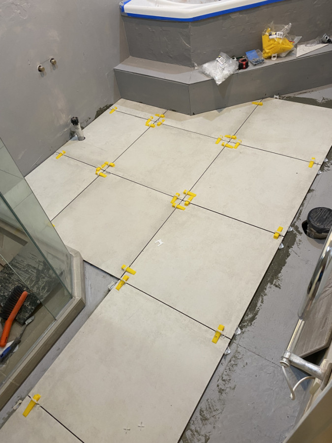 Floor tiling in progress