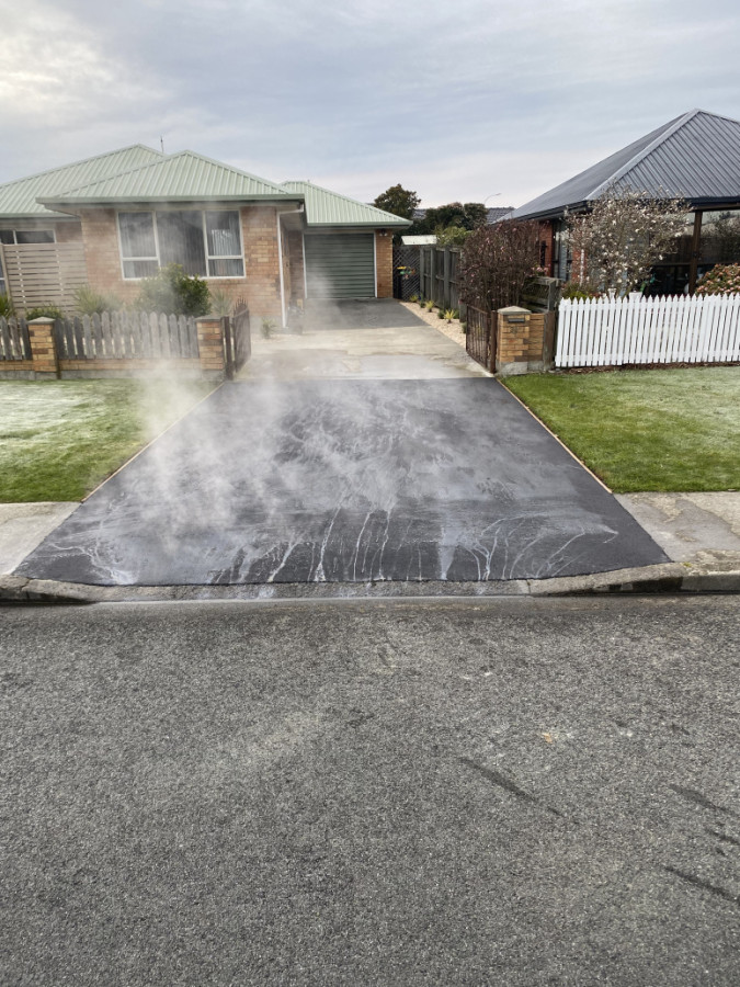 A small vehicle crossing we dug out boxed prepped and sealed the asphalt