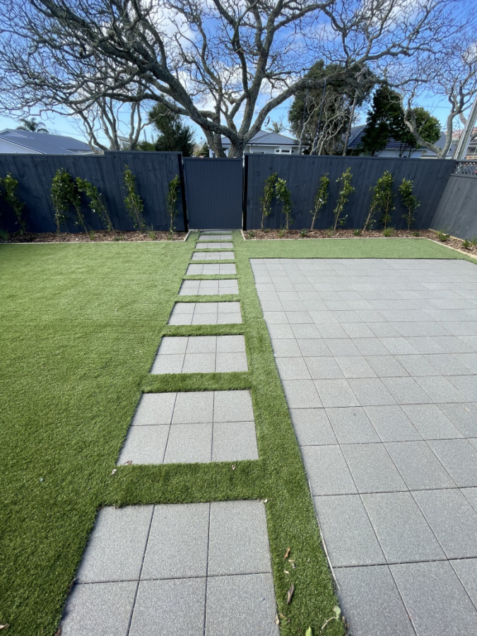 Paver steps next to paved patio