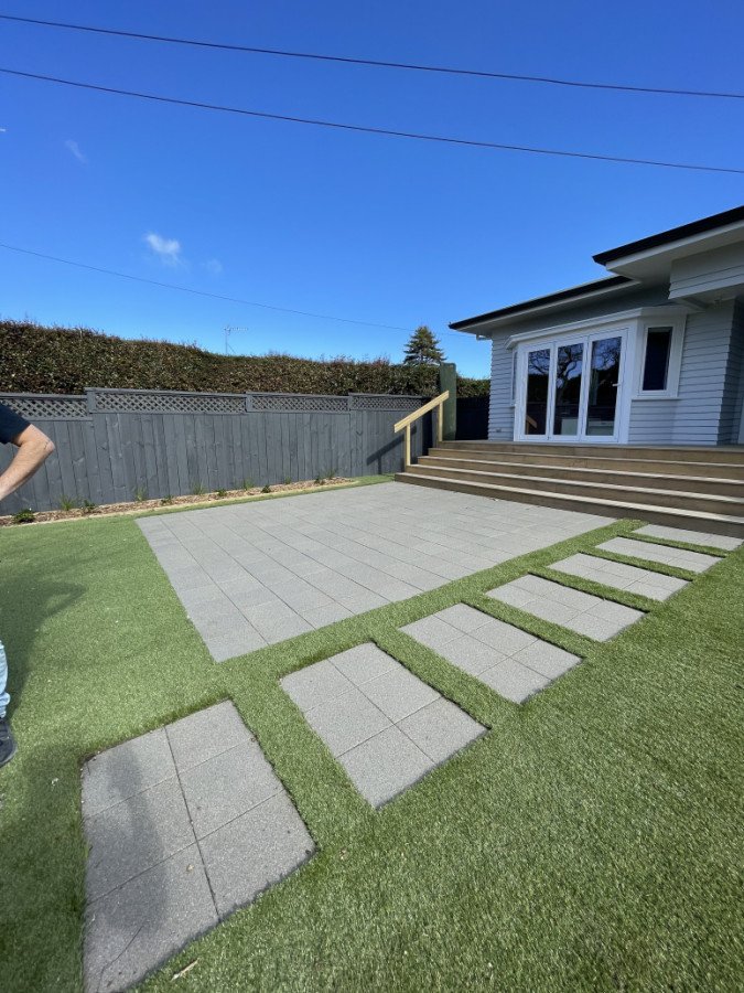 Finished look of pavers next to turf