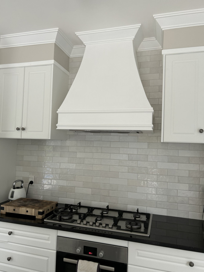 This is wooden range hood custom built for this kitchen
