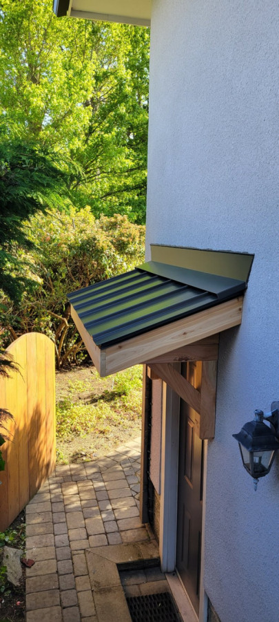 Custome made cedar fram awning with colour steel standing seam roof