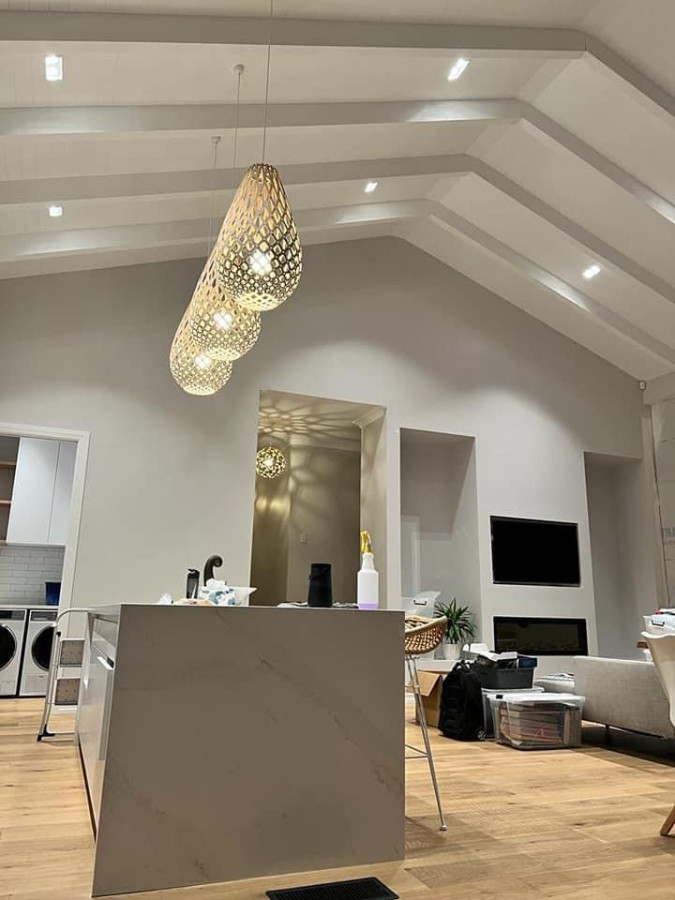 The expose solid timber feature on the ceiling blending perfect with the high ceiling