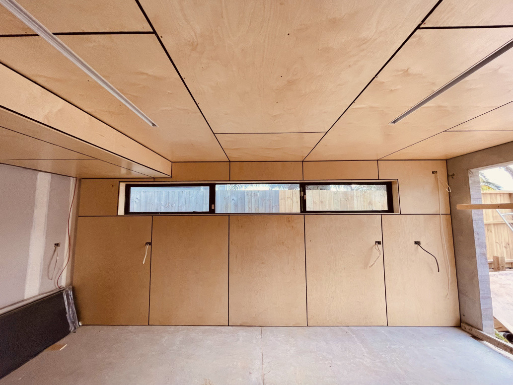 Our client wanted to line his garage with ply. We suggested a 10mm black negative detail at the joins to really make it a feature. We were very pleased with the end result!