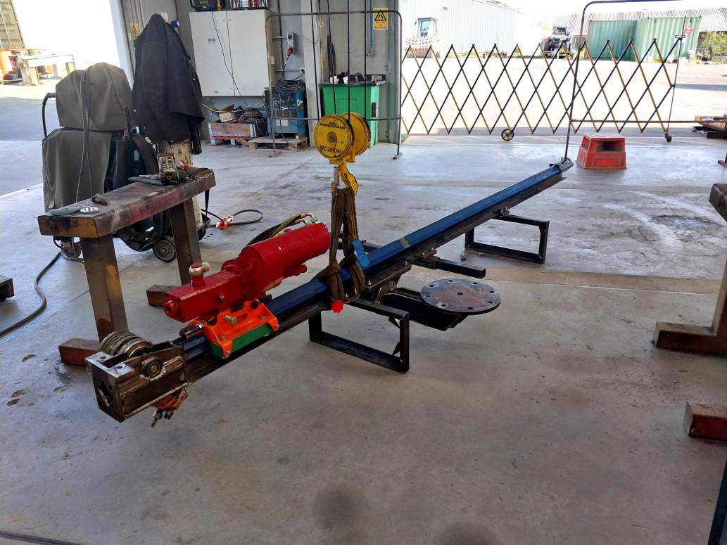 Drill mast digger attachment