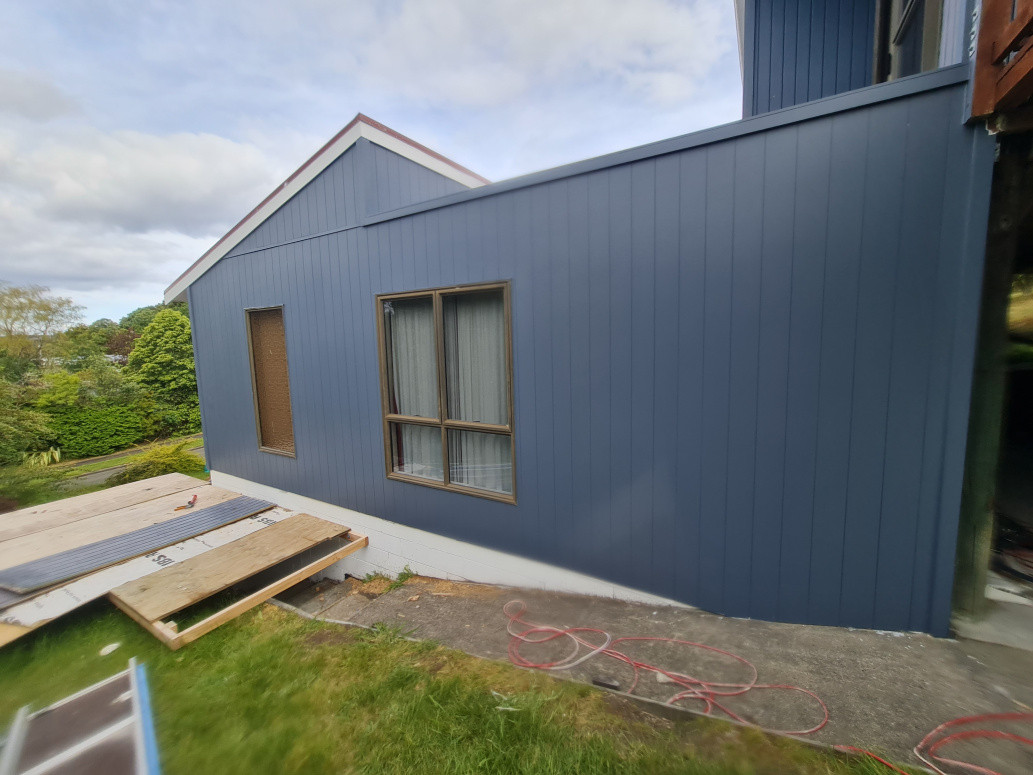 Replaced exterior sheets with new fibre cement V grooveline sheets, fulled sanded and painted exterior