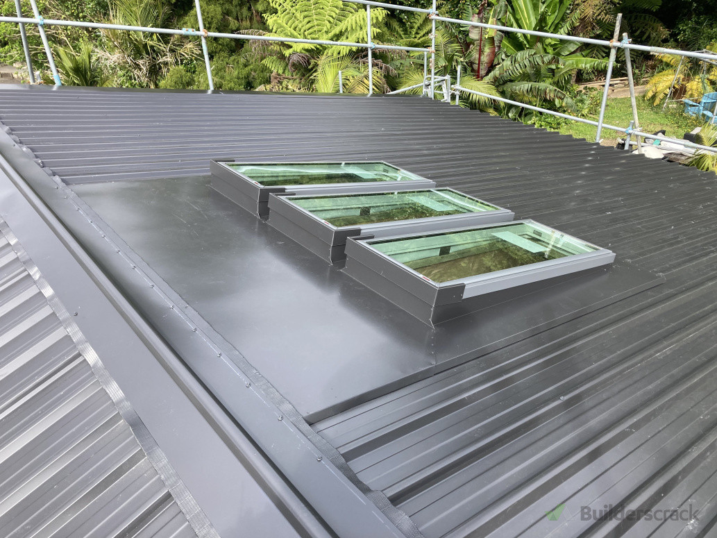 Custom flashing system for triple fixed skylight