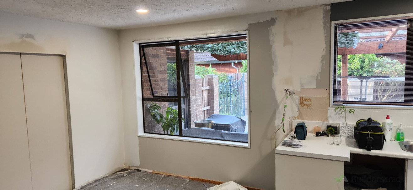 In this photo you can see the right side where the old wall was. On the left, the Construction of frame for new wall, separating new lounge from kitchen with sliding doors