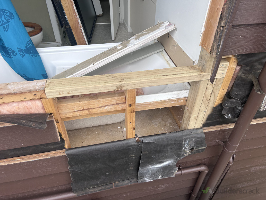 Frames and rotten weatherboard cut out and re framed.