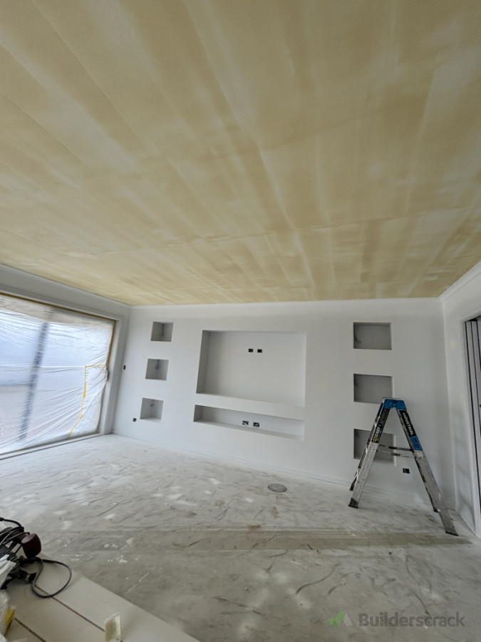 Level 5 skim coat on this lounge ceiling due to the amount of critical light coming through the slidin doors and reflecting on the ceilings