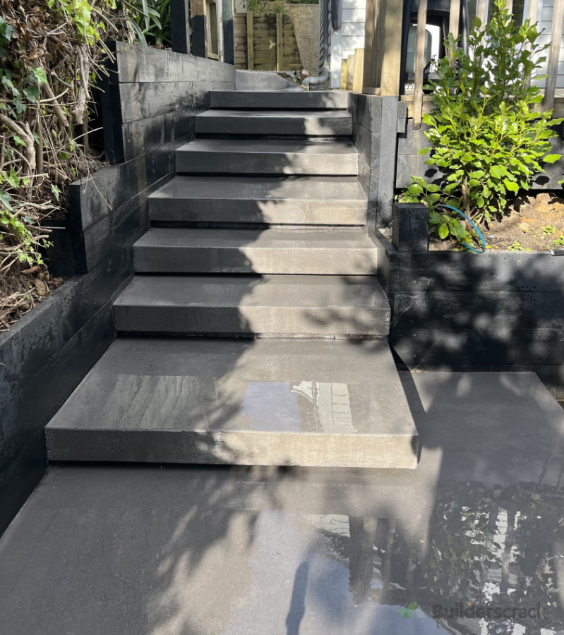 Floating concrete steps with clear sealer and glass grit.