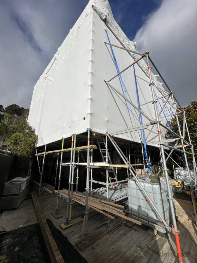 During - Full Wrapped Scaffold, Work proceeds regardless of weather!