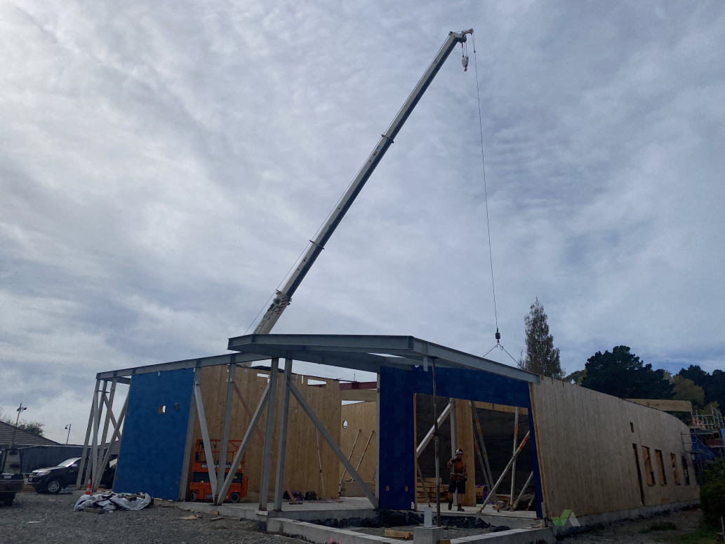 Steel members lifted in place