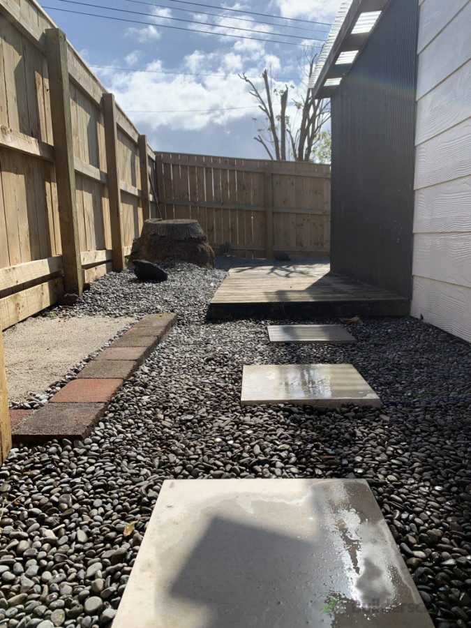 Mortared pavers, with river stone border and brick line to frame pot plants