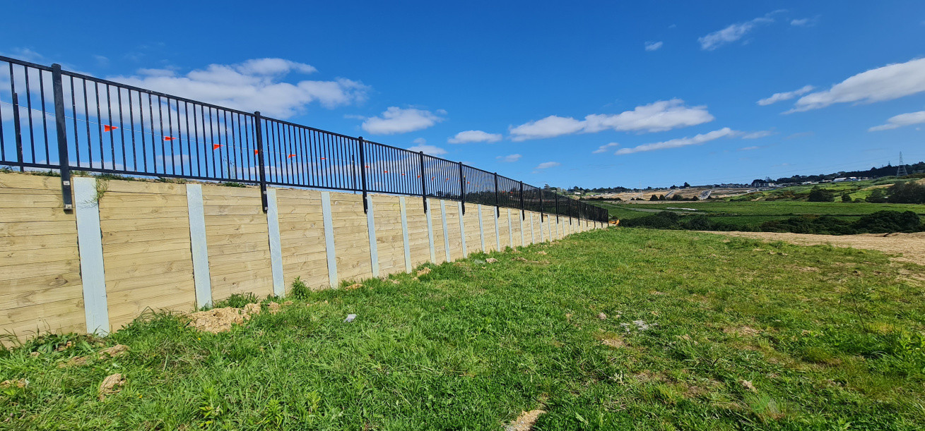 Premier panels on retaining wall in flat bush for a developer