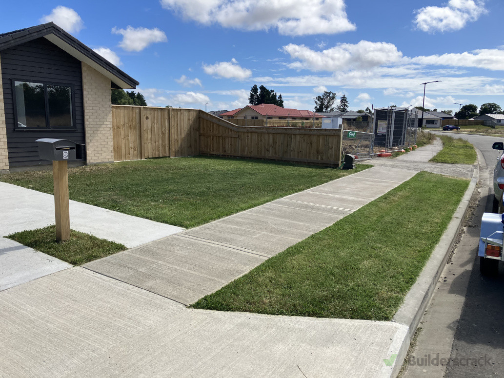 Front lawn, right side of driveway