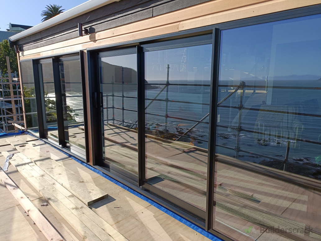 New sliding doors and weatherboards installation