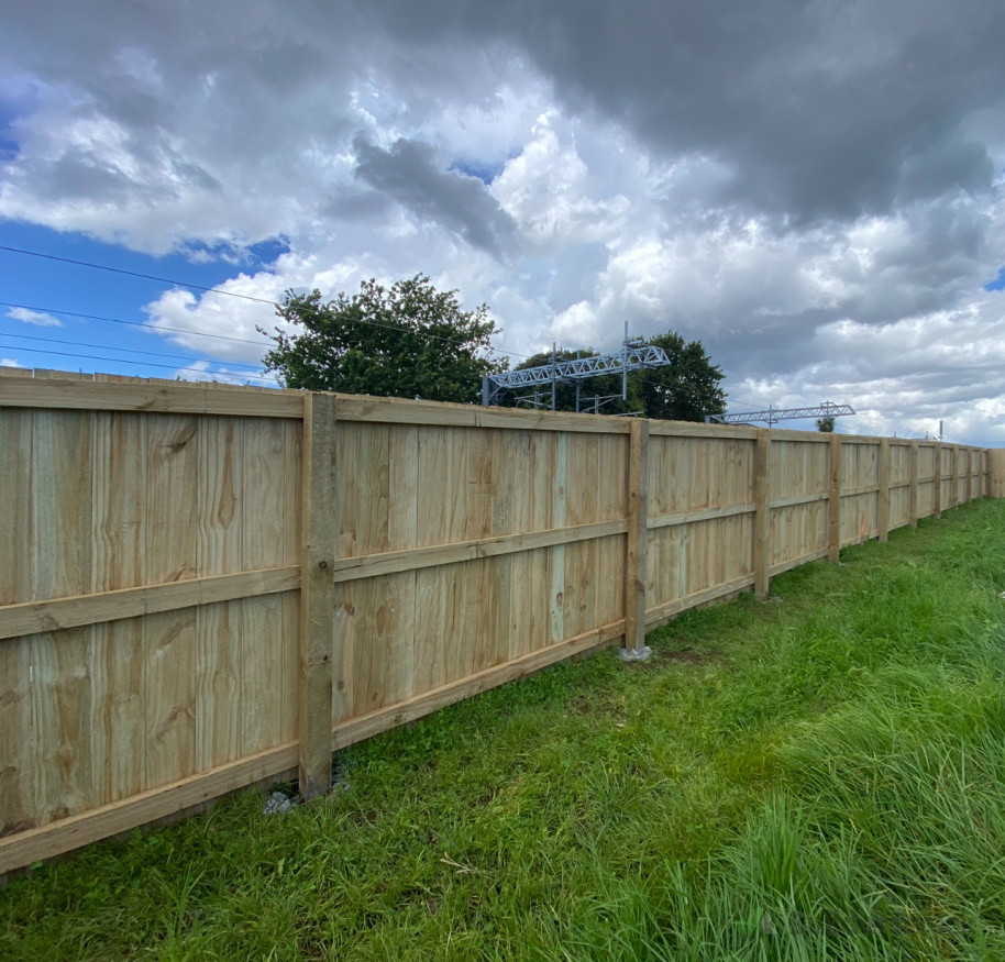 1.8m timber fence, rail over.