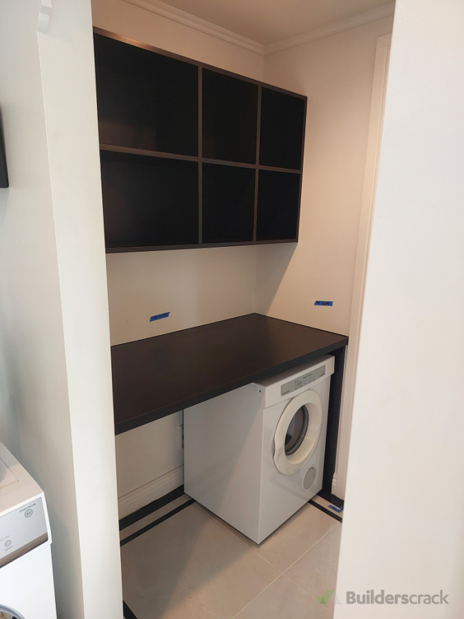 Matt back Benchtop and shelving installed, giving a crisp look to the laundry