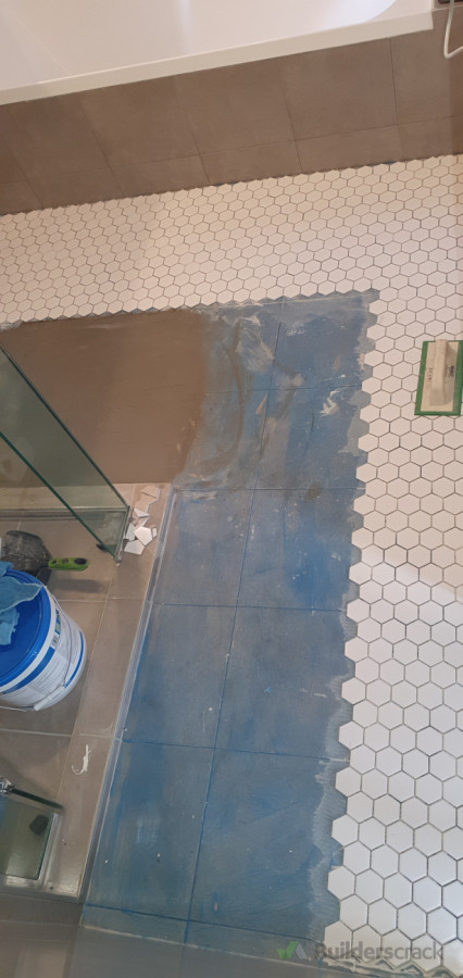 Halfway through tiling mosaic over existing tile for refreshed look