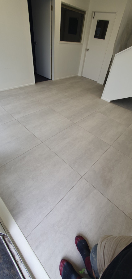 Tiled this commercial entry using thin 900 x 900 tile over existing tile.