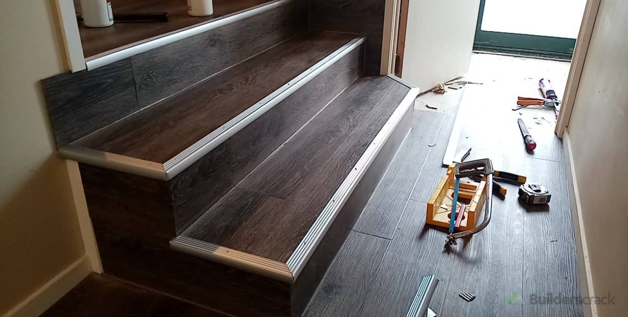 Beautiful little set of mitered staircase in vinyl plank.